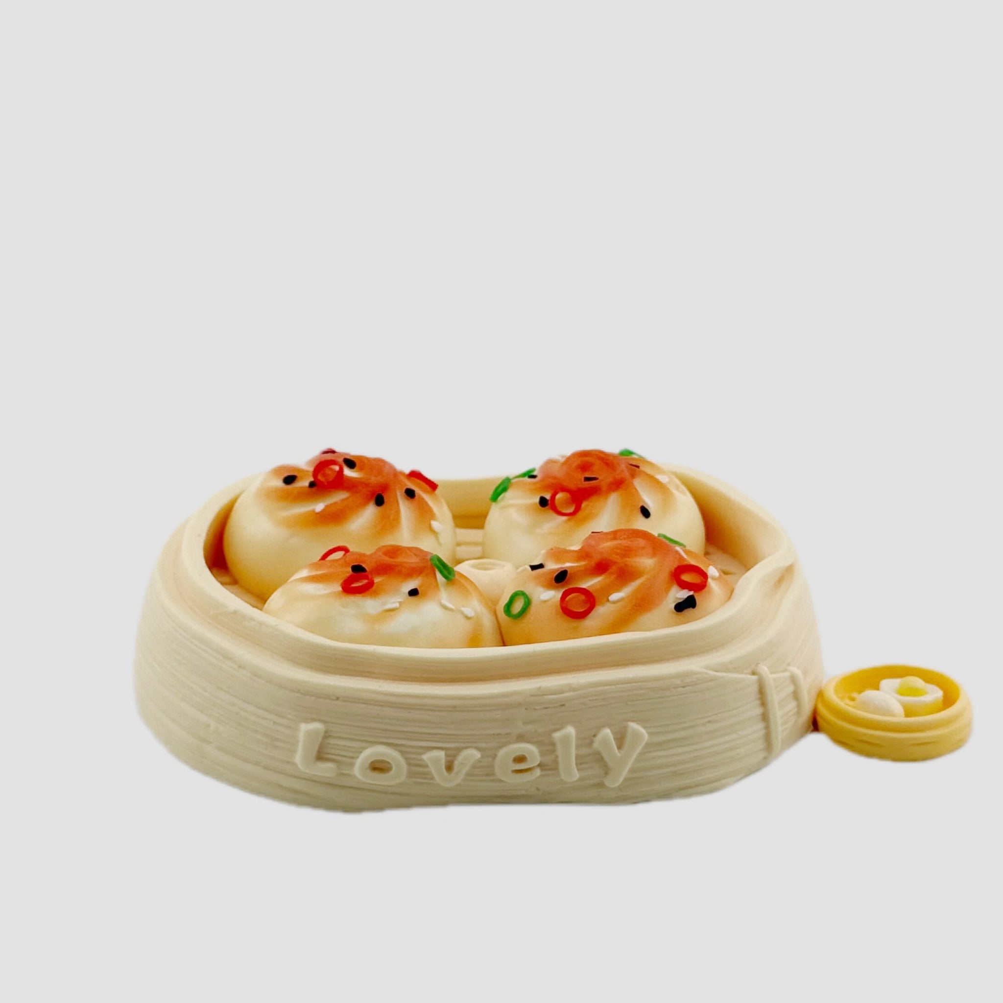 Dumpling squishy toy set designed as a full steamer basket with four topped dumplings